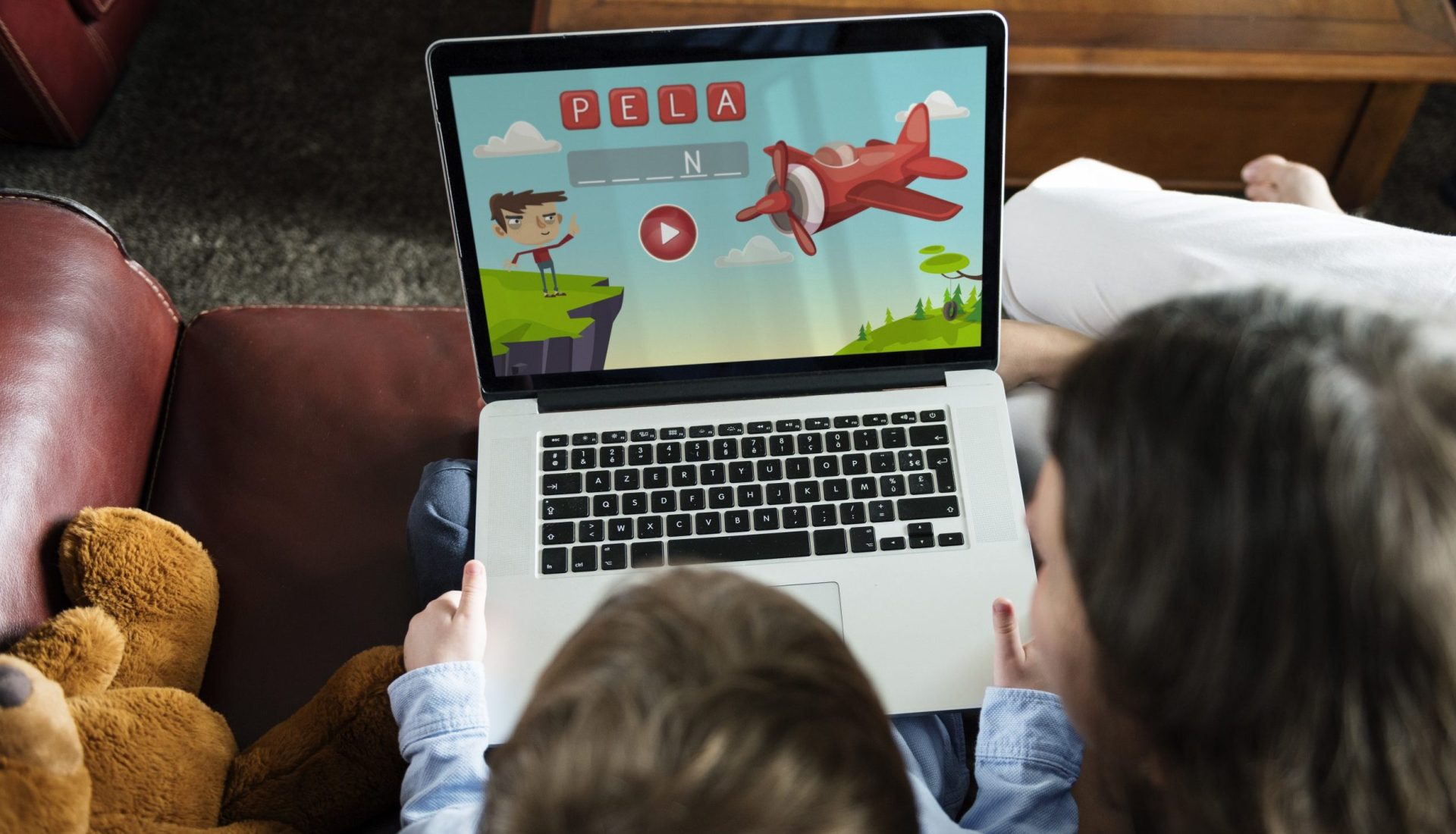 Son and Mom Using Laptop E-learning Game Education at Home